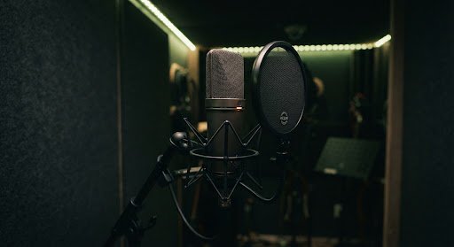 Voice over microphone and pop filter in a professional studio